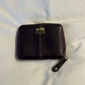 Coach wallet with zippered closure.two separate inside compartments